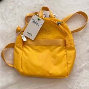 Kipling mini yellow back pack